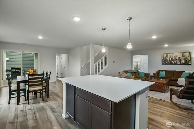 a large kitchen with a table and chairs