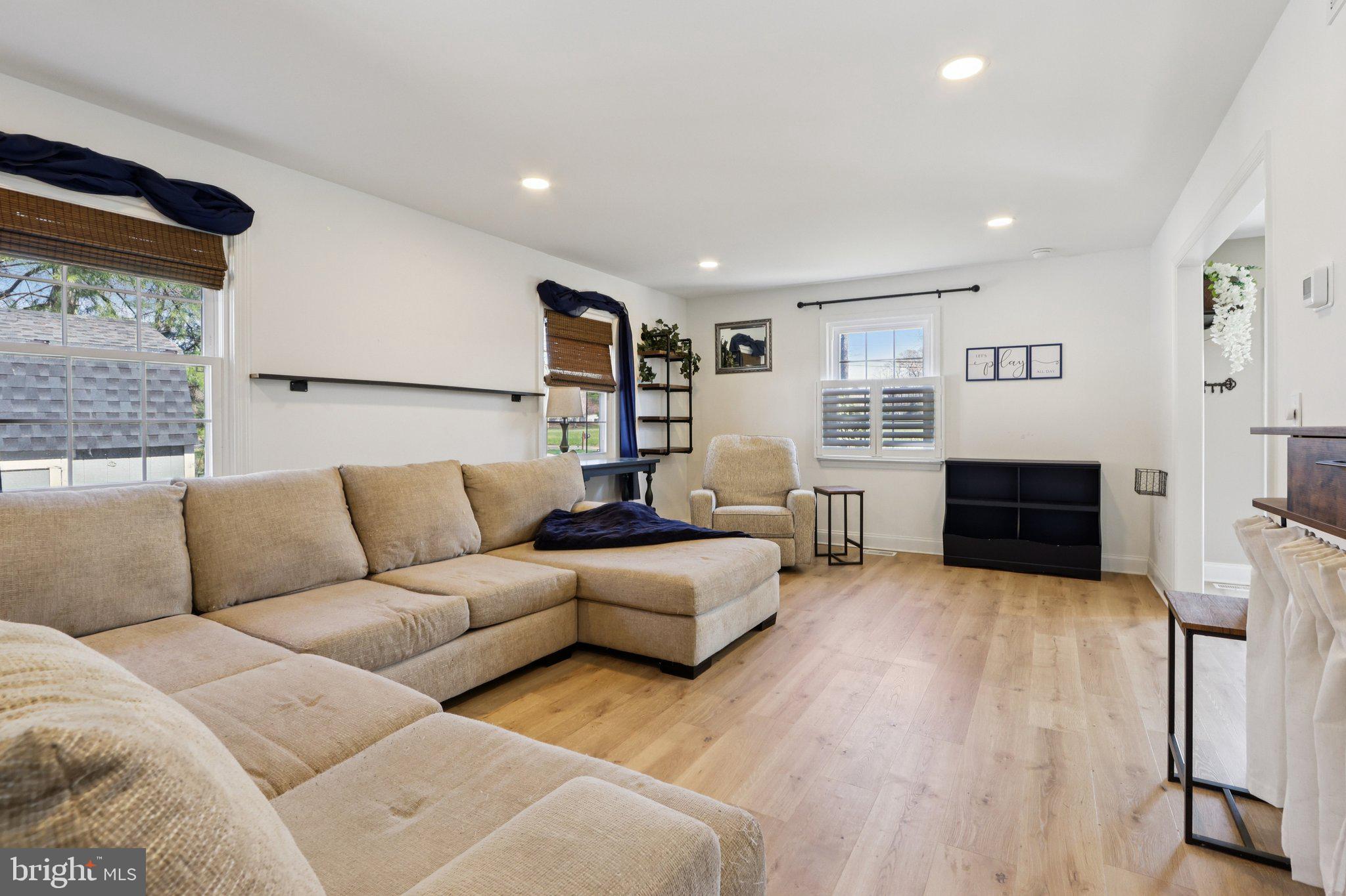 351 Merrick Road Robbinsville, NJ 08691 - Photo 15 of 69 a living room with furniture and a flat screen tv