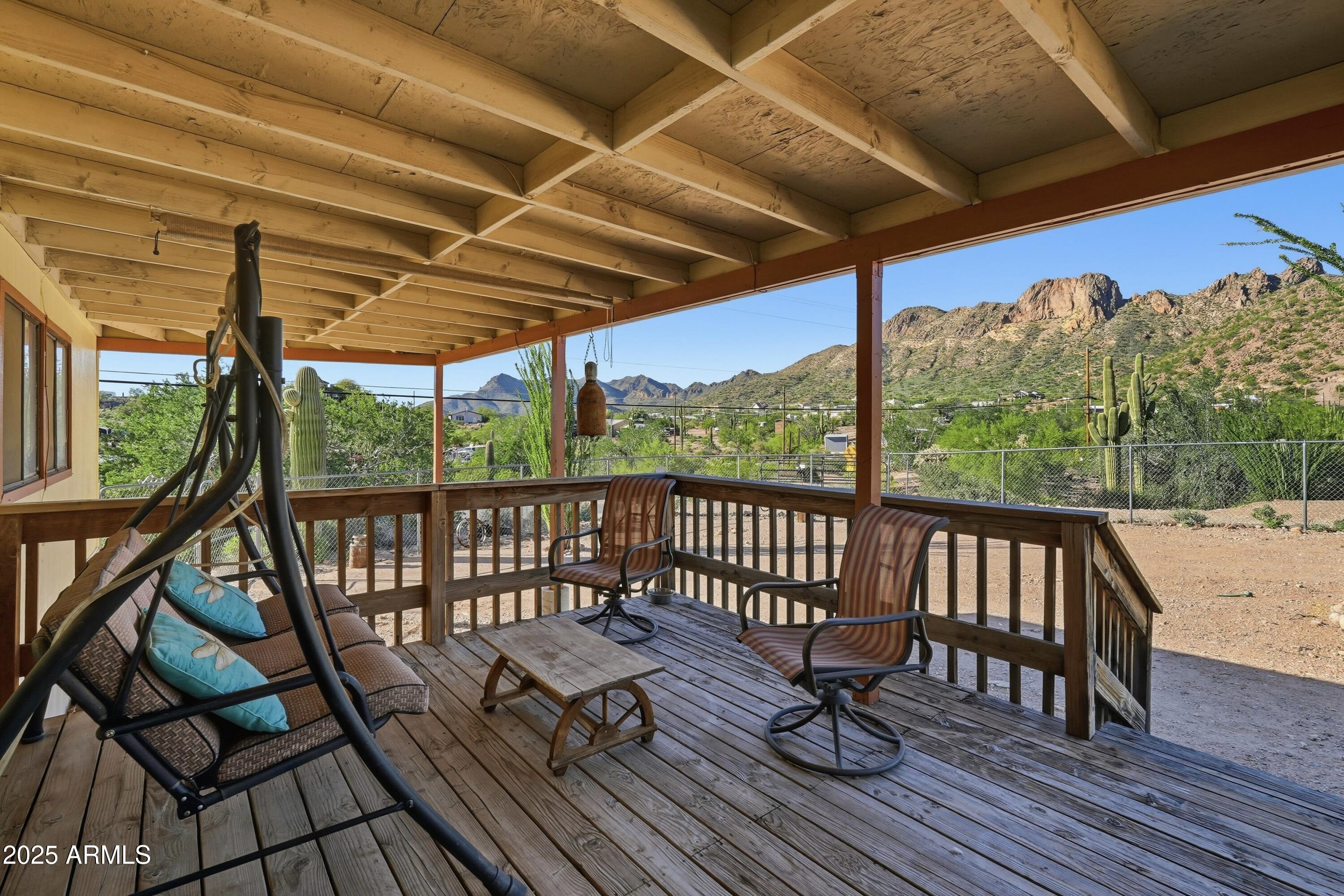 a view of a two chairs in the balcony