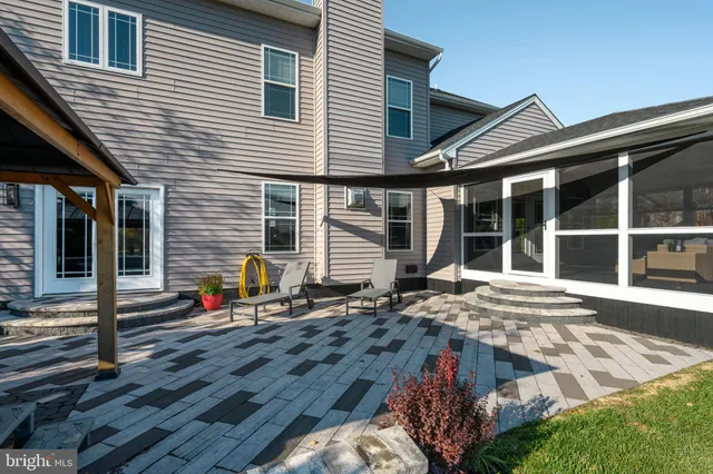 a living room with furniture and a lamp