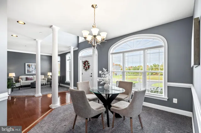 a bedroom with a bed a couch and a window