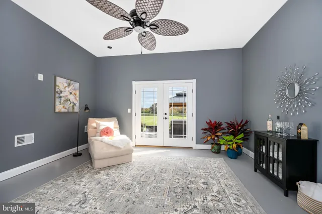 a kitchen with a refrigerator sink and cabinets