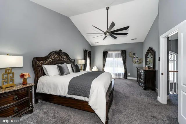 a front view of a house with a yard table and garage