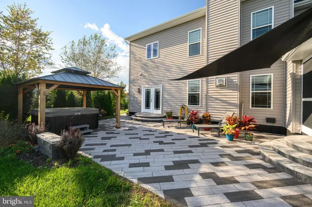 a view of a dining room with furniture wooden floor and chandelier