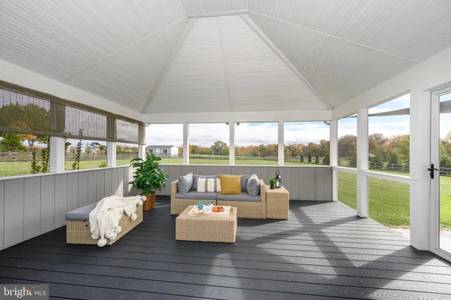 a living room with fireplace furniture and a flat screen tv