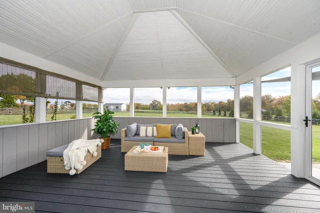 a bathroom with a sink a toilet a shower curtain and a bath tub