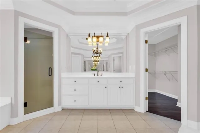 a view of an empty room with a fireplace and window