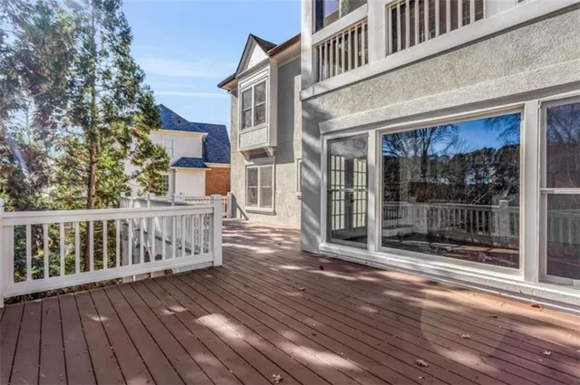 a bed sitting in a bedroom next to a wall