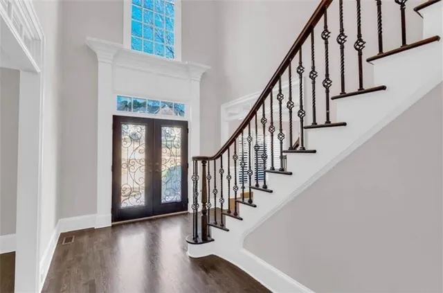 a view of an entryway with wooden floor
