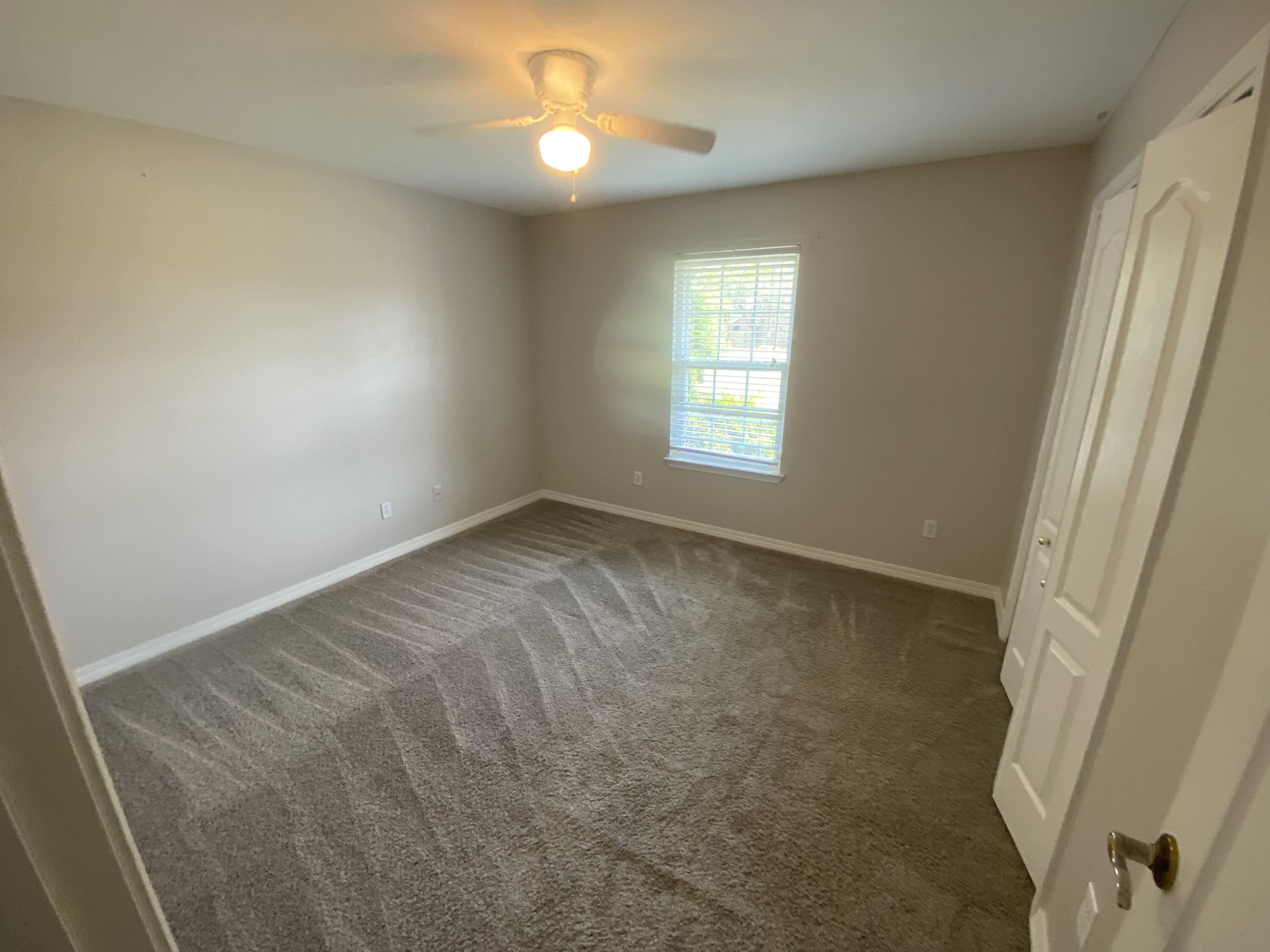 6568 Fern Street Navarre, FL 32566 - Photo 8 of 10 a view of an empty room and window