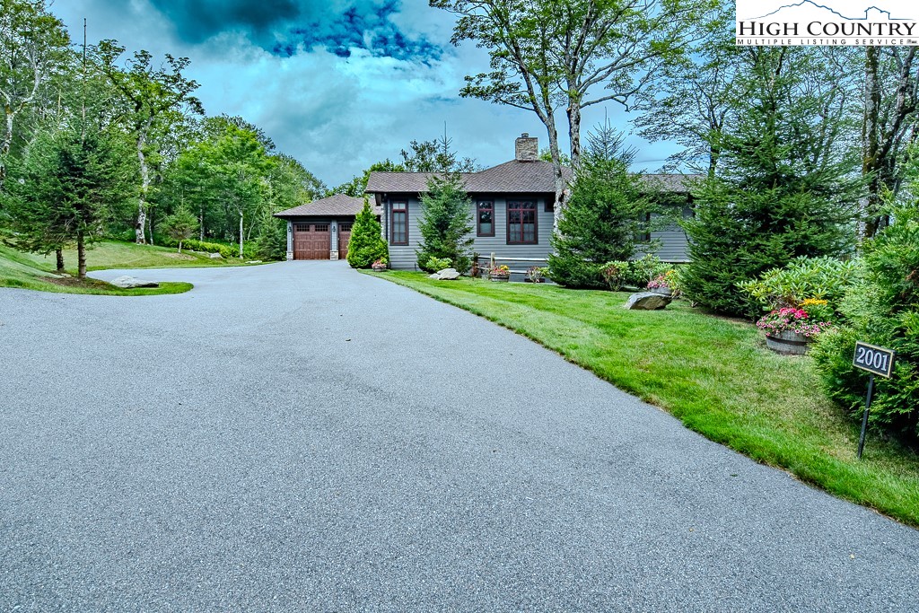 2001 Moon Run Linville, NC 28646 - Photo 2 of 33 a front view of a house with a yard and trees