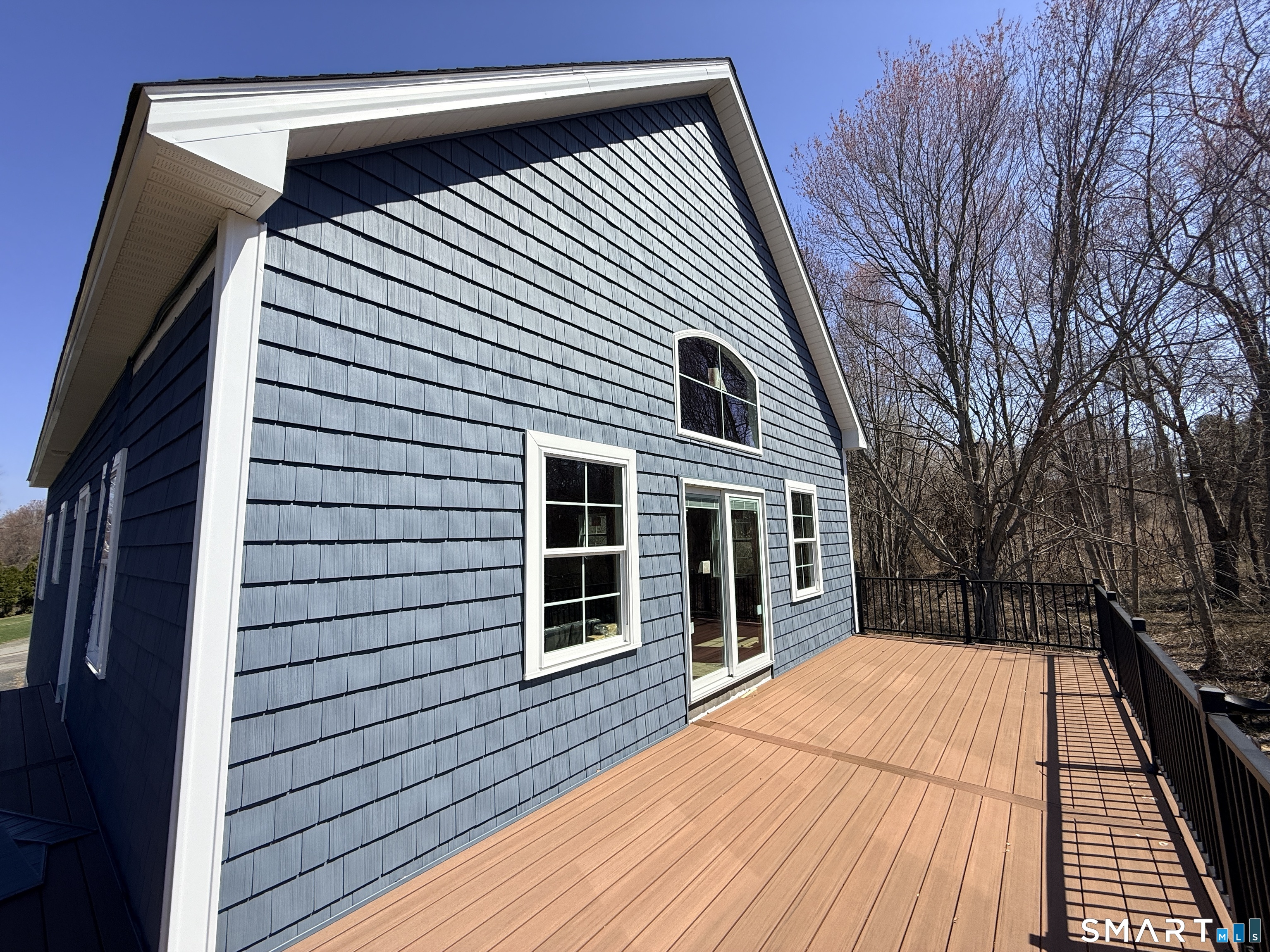 7 Larson Street Waterford, CT 06385 - Photo 11 of 23 a view of a house with a deck
