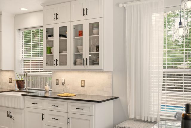 a bathroom with a sink and a window