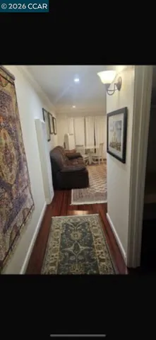 a view of living room with furniture and window
