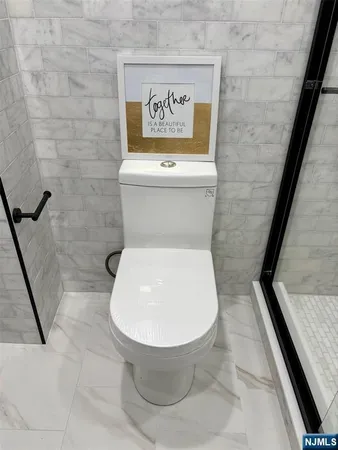 a bathroom with a toilet and a sink