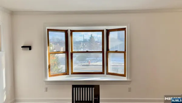 a view of a door and a window