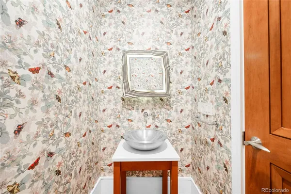 a bathroom with a toilet and a shower curtain