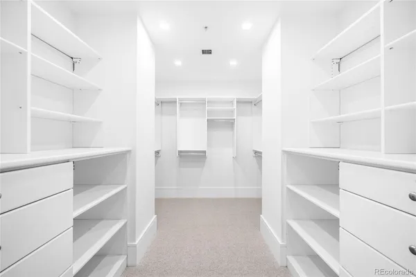 a view of an empty walk in closet