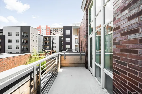 a view of balcony with a floor to ceiling window