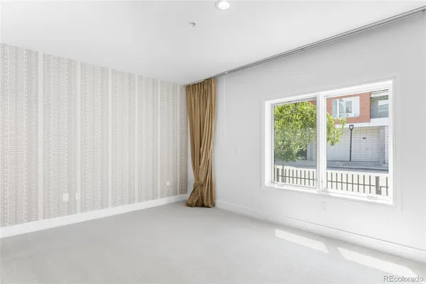 a view of a room with a large window