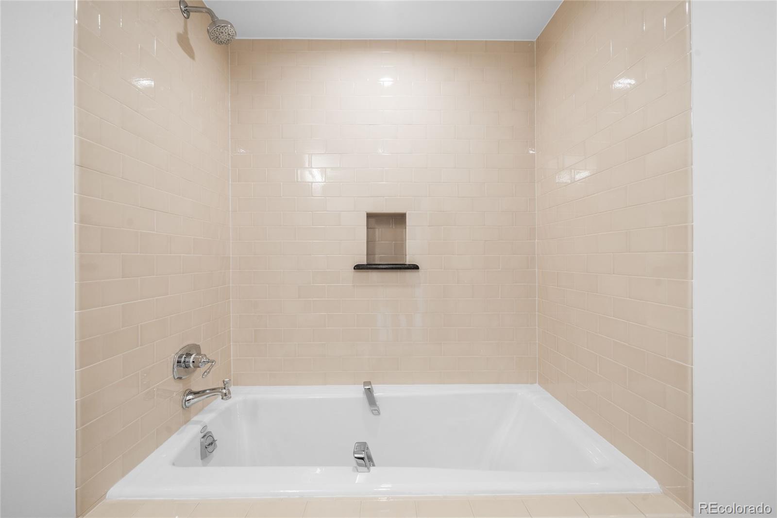 2133 18th Street, Unit RL Denver, CO 80202 - Photo 32 of 46 a bathroom with a bathtub