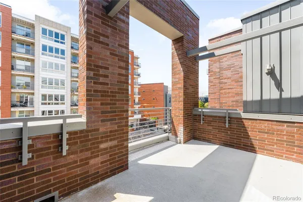 a view of a balcony with wooden floor