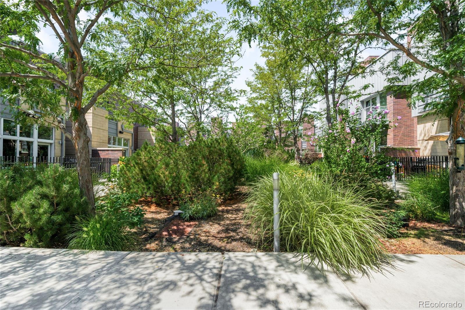 2133 18th Street, Unit RL Denver, CO 80202 - Photo 42 of 46 a backyard of a house with lots of green space