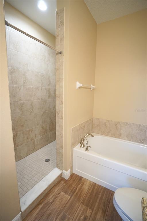 3525 West Ballast Point Boulevard Tampa, FL 33611 - Photo 18 of 25 a bathroom with a bathtub and a shower