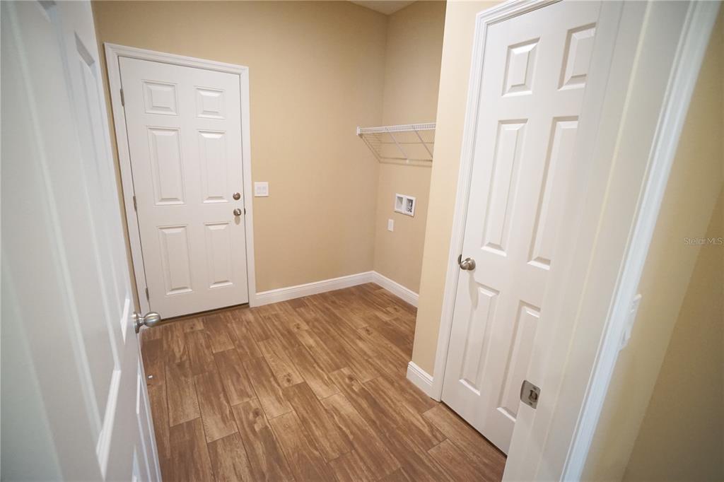 3525 West Ballast Point Boulevard Tampa, FL 33611 - Photo 21 of 25 a view of a hallway with wooden floor