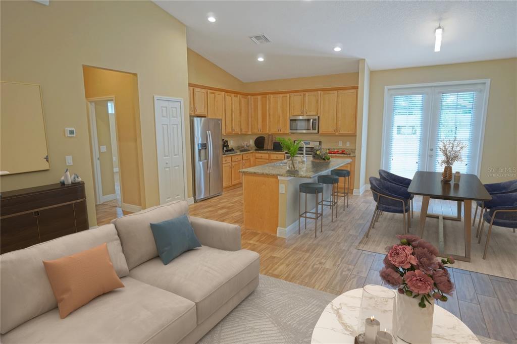 3525 West Ballast Point Boulevard Tampa, FL 33611 - Photo 4 of 25 a living room with furniture and wooden floor