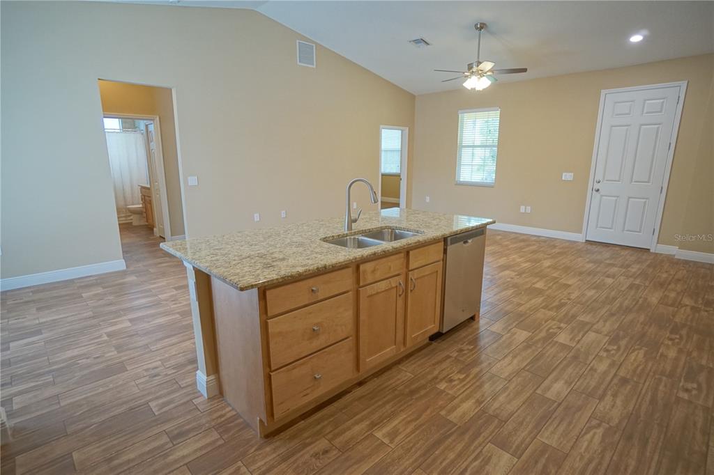 3525 West Ballast Point Boulevard Tampa, FL 33611 - Photo 10 of 25 a bathroom with a granite countertop sink and a mirror