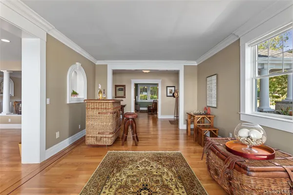 a living room with furniture and large windows