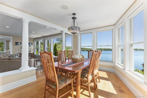 a kitchen with stainless steel appliances granite countertop wooden floors stove top oven and sink
