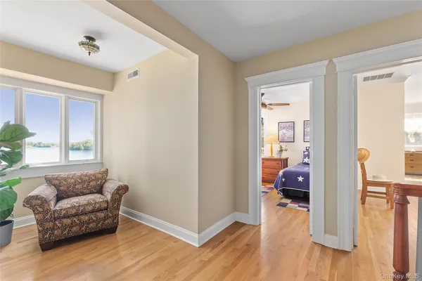 a view of a swimming pool and an outdoor seating