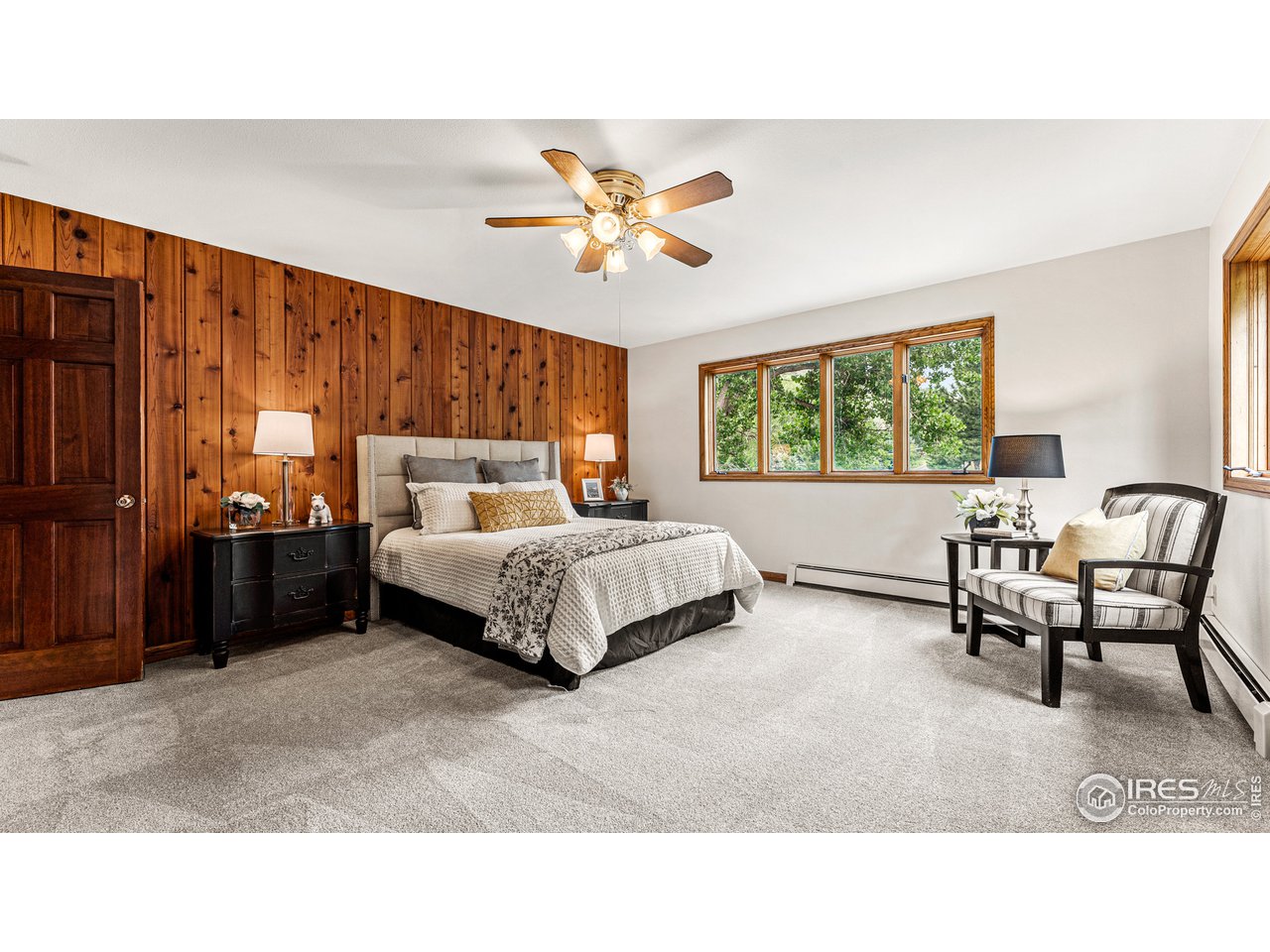 7333 Olde Stage Road Boulder, CO 80302 - Photo 19 of 40 a bedroom with a bed and a chandelier
