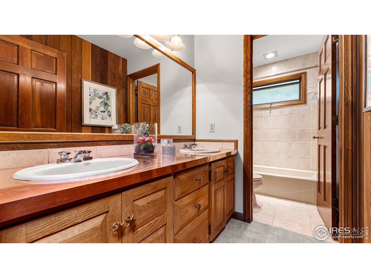 7333 Olde Stage Road Boulder, CO 80302 - Photo 22 of 40 a bathroom with a sink double vanity and a mirror