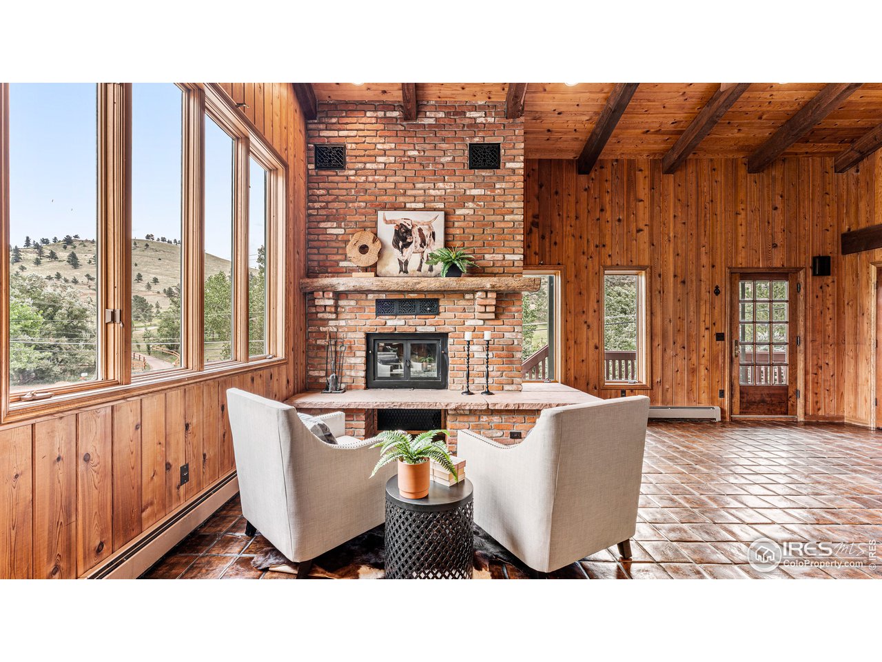 7333 Olde Stage Road Boulder, CO 80302 - Photo 5 of 40 a outdoor living space with furniture and a fireplace