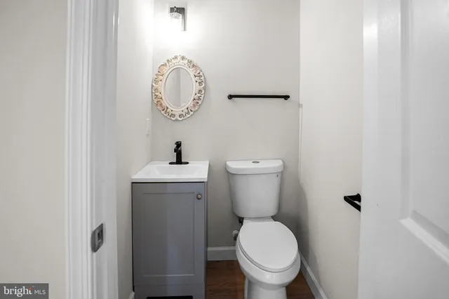 a bathroom with a toilet and a sink