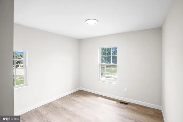 an empty room with windows