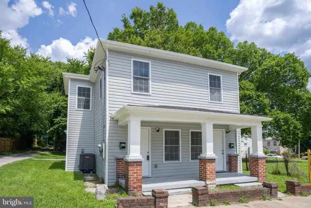 front view of a house with a yard