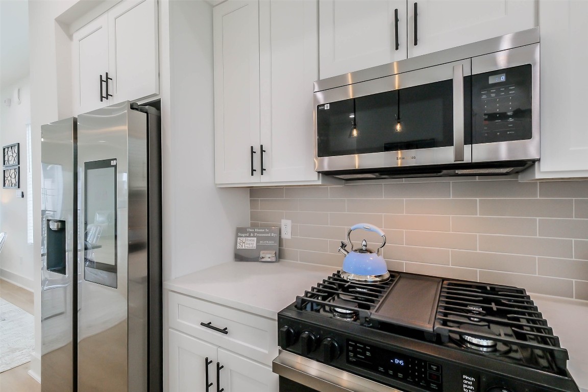 5703 B Balbo Street Houston, TX 77091 - Photo 15 of 46 a kitchen with stainless steel appliances a stove and a microwave