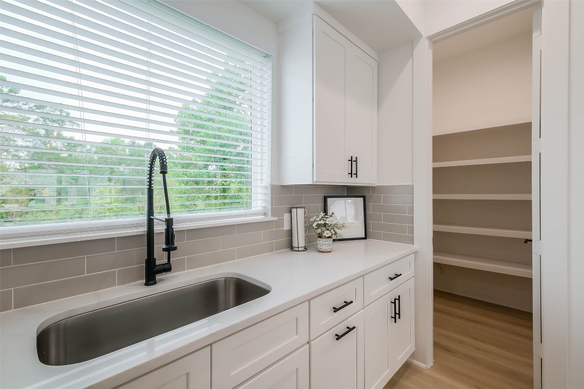 5703 B Balbo Street Houston, TX 77091 - Photo 17 of 46 a kitchen with a sink and a window