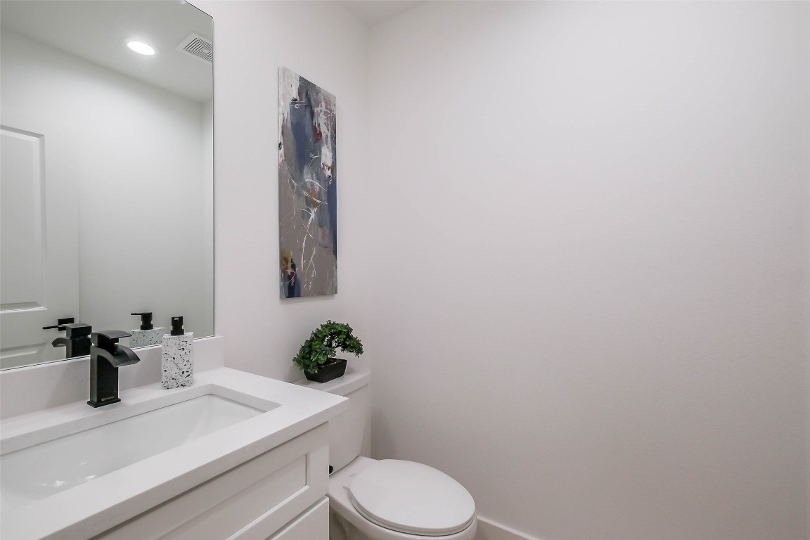 5703 B Balbo Street Houston, TX 77091 - Photo 21 of 46 a bathroom with a sink vanity and toilet