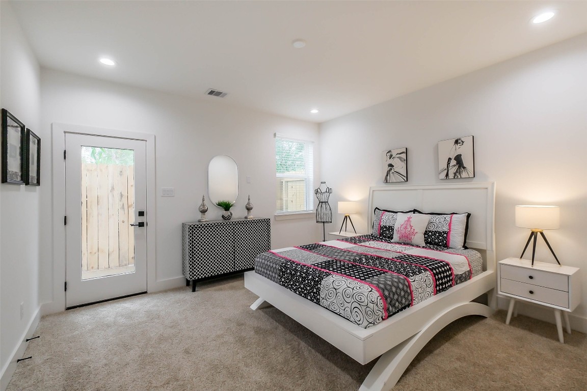 5703 B Balbo Street Houston, TX 77091 - Photo 33 of 46 a bedroom with a bed and a dresser