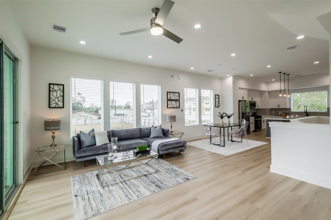 5703 B Balbo Street Houston, TX 77091 - Photo 8 of 46 a living room with furniture and a large window