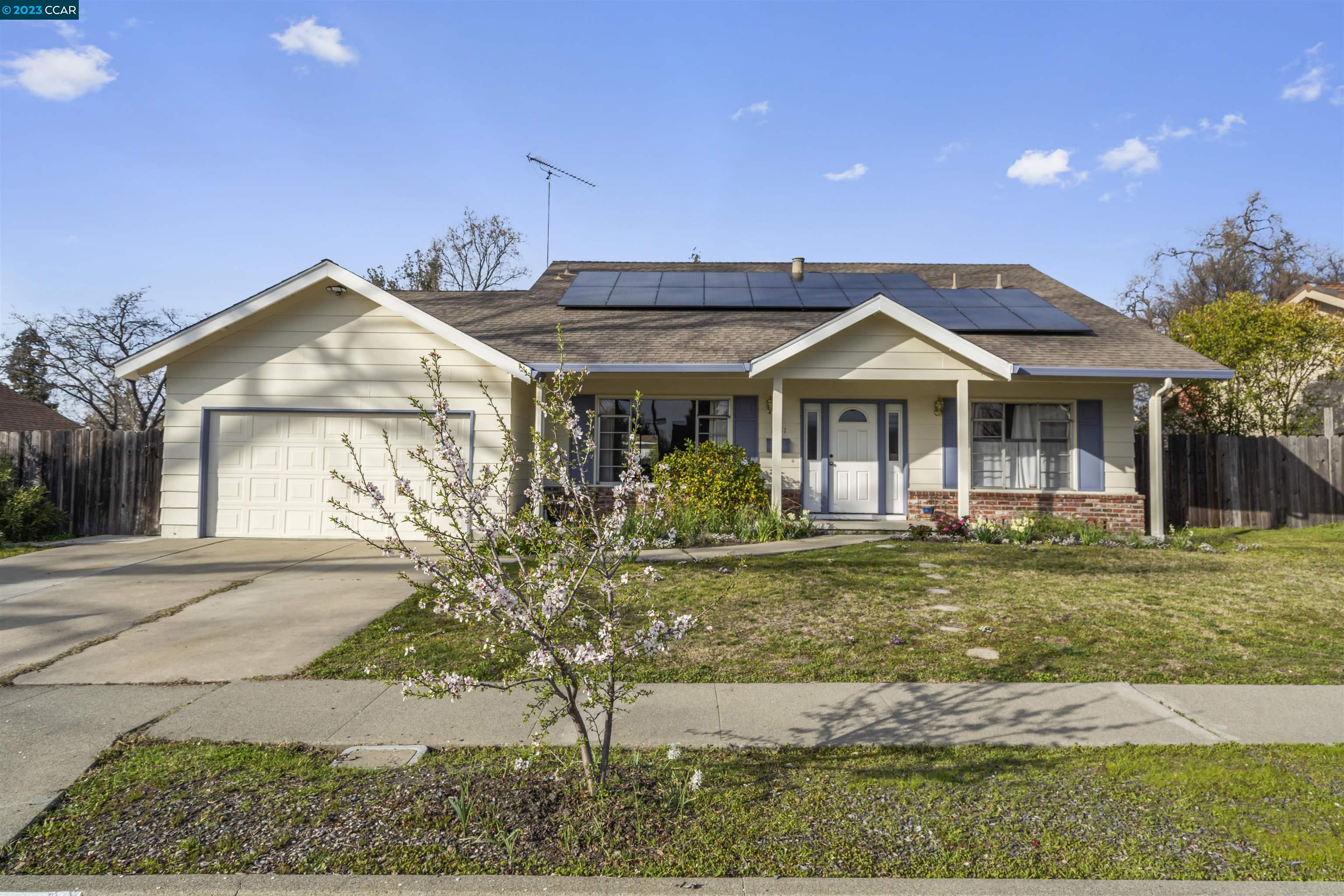 a front view of a house with garden