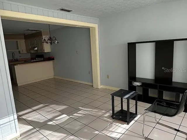 a view of a entryway door and hallway