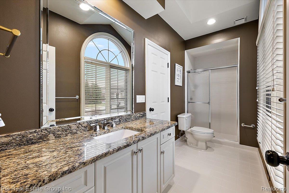 3571 Cedar Brook Drive Rochester, MI 48309 - Photo 43 of 57 Bathroom featuring vanity and a stall shower
