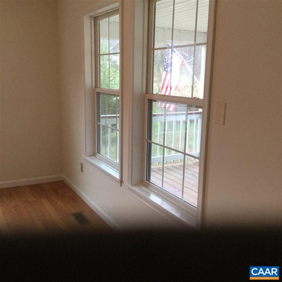 316 High View Road Stanardsville, VA 22973 - Photo 8 of 21 a view of empty room with wooden floor and fan