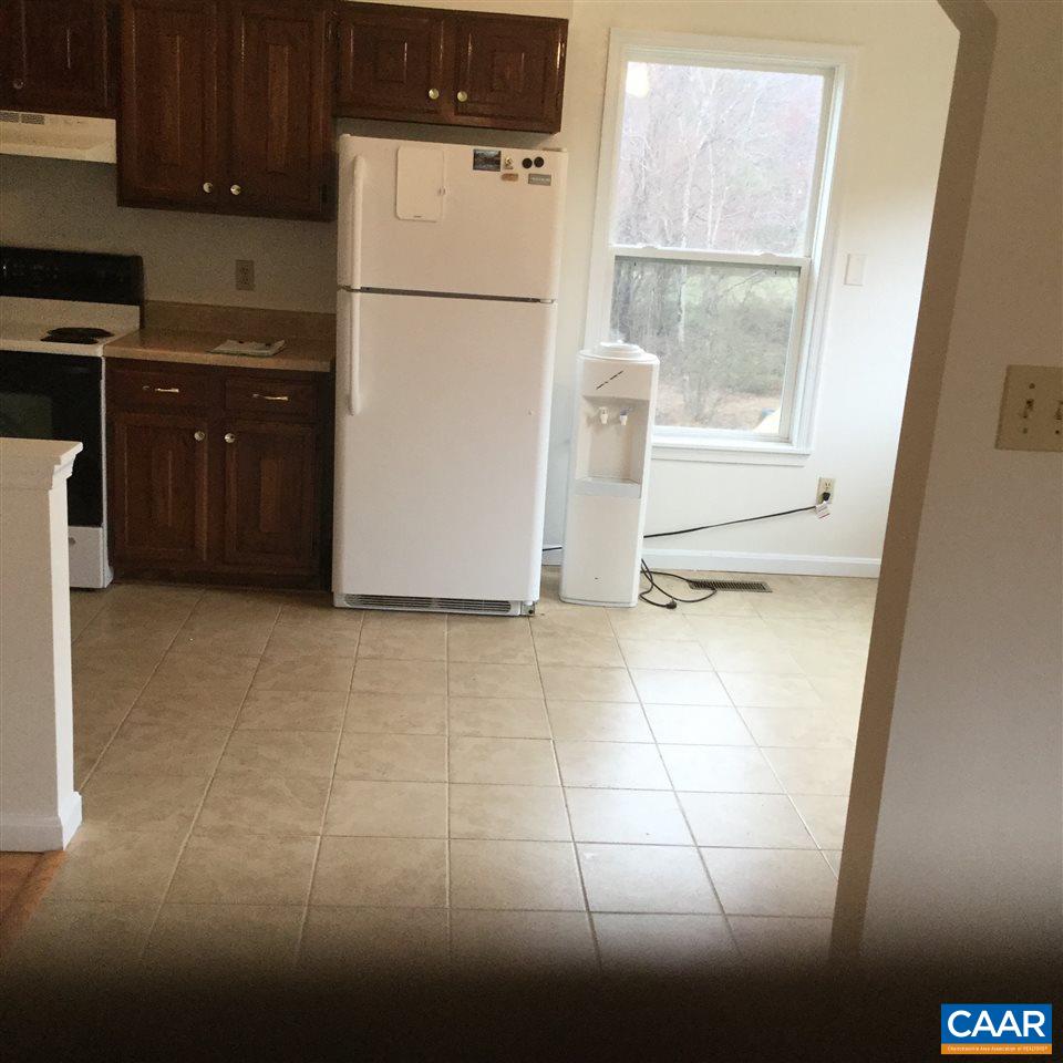 316 High View Road Stanardsville, VA 22973 - Photo 10 of 21 a kitchen with a refrigerator a stove top oven a sink and a window